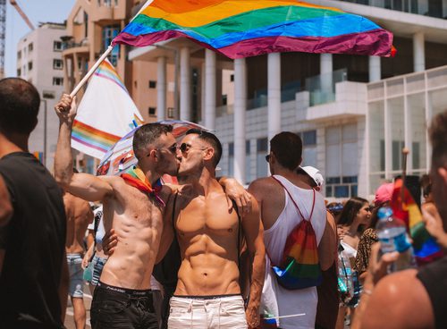 gay men kissing on tel aviv pride parade